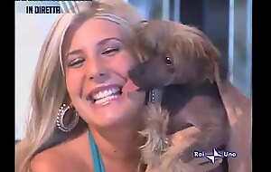 Oops Upskirt as this babe picks round a puppy on TV