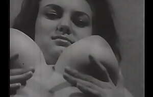 Vintage porn model demonstrates an appetizing congress and beautiful big melons in a black and white photo session