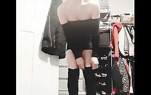 Femboy wearing tight club dress and suede haunch high boots