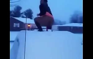 Crazy black girl having it away a sex tool on a car roof in rub-down the snow