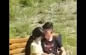 Asian couple filmed in the public park