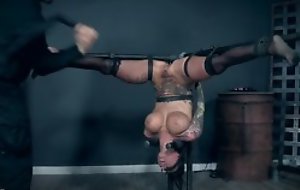 Inked bitch with fake tits pleasuring her master in BDSM action