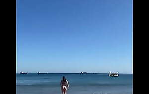 GIRL Strolling ON THE Seashore