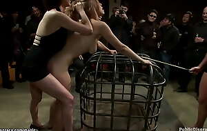 Busty blond locked in cage and groped