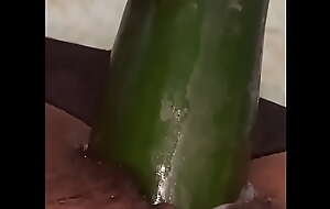 Filipino cam girl Andrea Kwan using cucumber for dildo