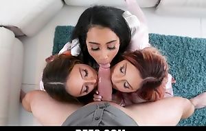 Three mischievous young women getting drilled nearby turn