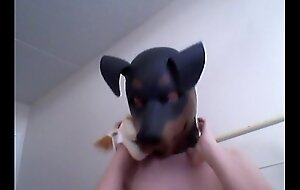 Kinky Girl gets off debilitating a rubber dog veil