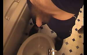 Hairy cock and balls lad takes a piss