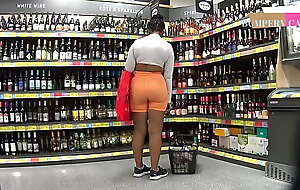 Juicy Ebony MILF with some hot goods in orange spandex gym shorts