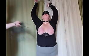 Submissive's breast gets punished