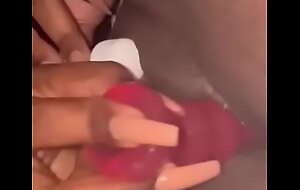 Ebony plays with vibrator on her pussy
