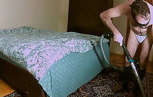 Earl cleans the bedroom regarding a vacuum cleaner