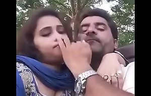pair unsettle kissing in park selfi video