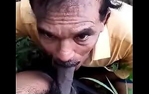 Desi uncle sucking cock of young guy in jungle
